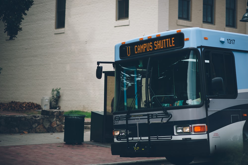 a city bus parked on the side of the road