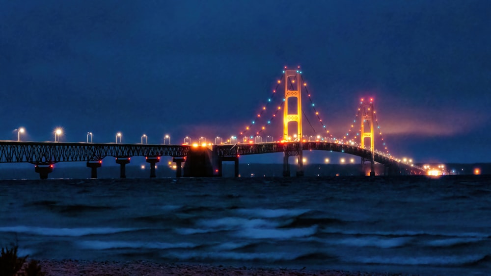 a bridge that is lit up at night