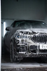 Car covered in soap suds at a car wash