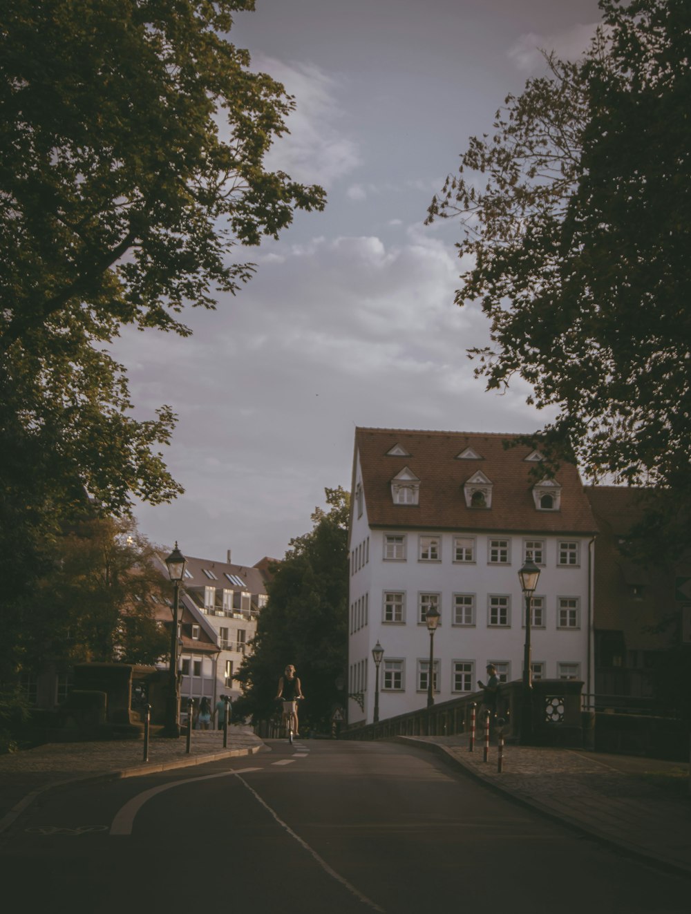 a white building sitting on the side of a road