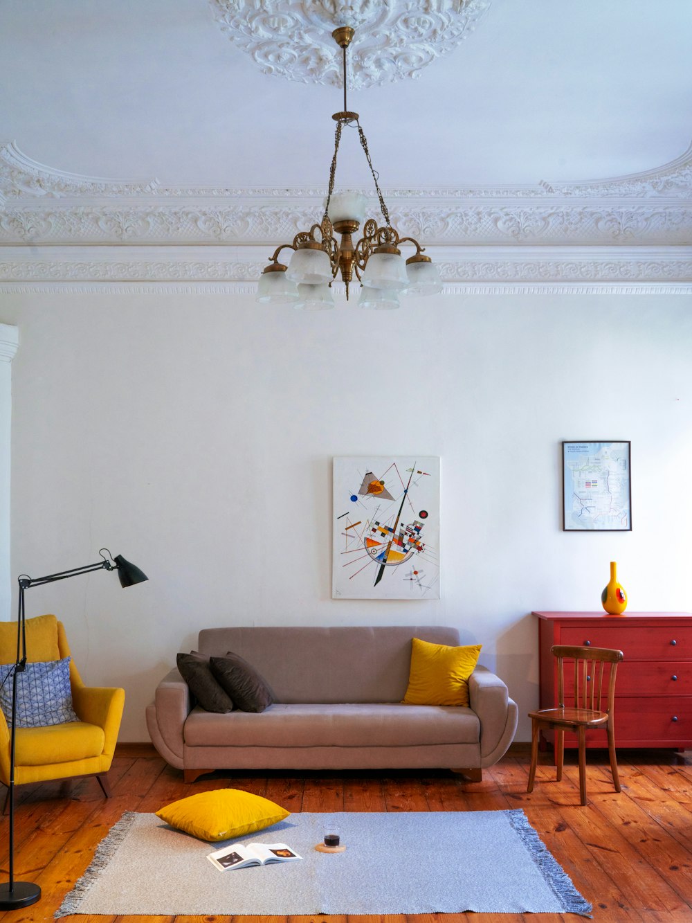 a living room filled with furniture and a chandelier