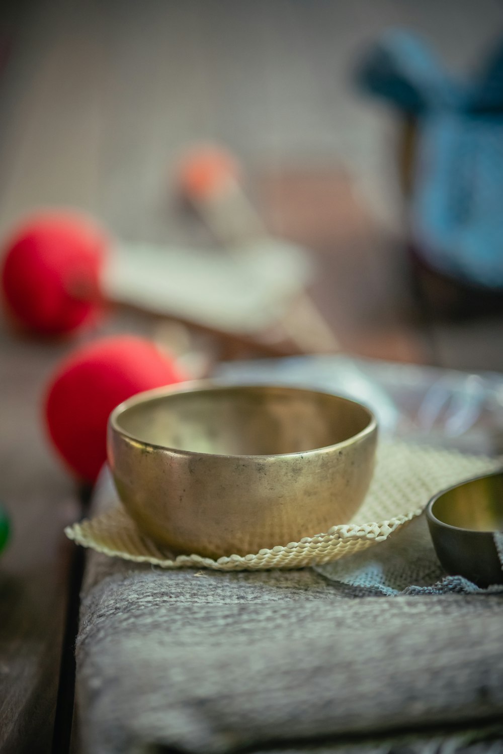 a metal bowl sitting on top of a wooden table