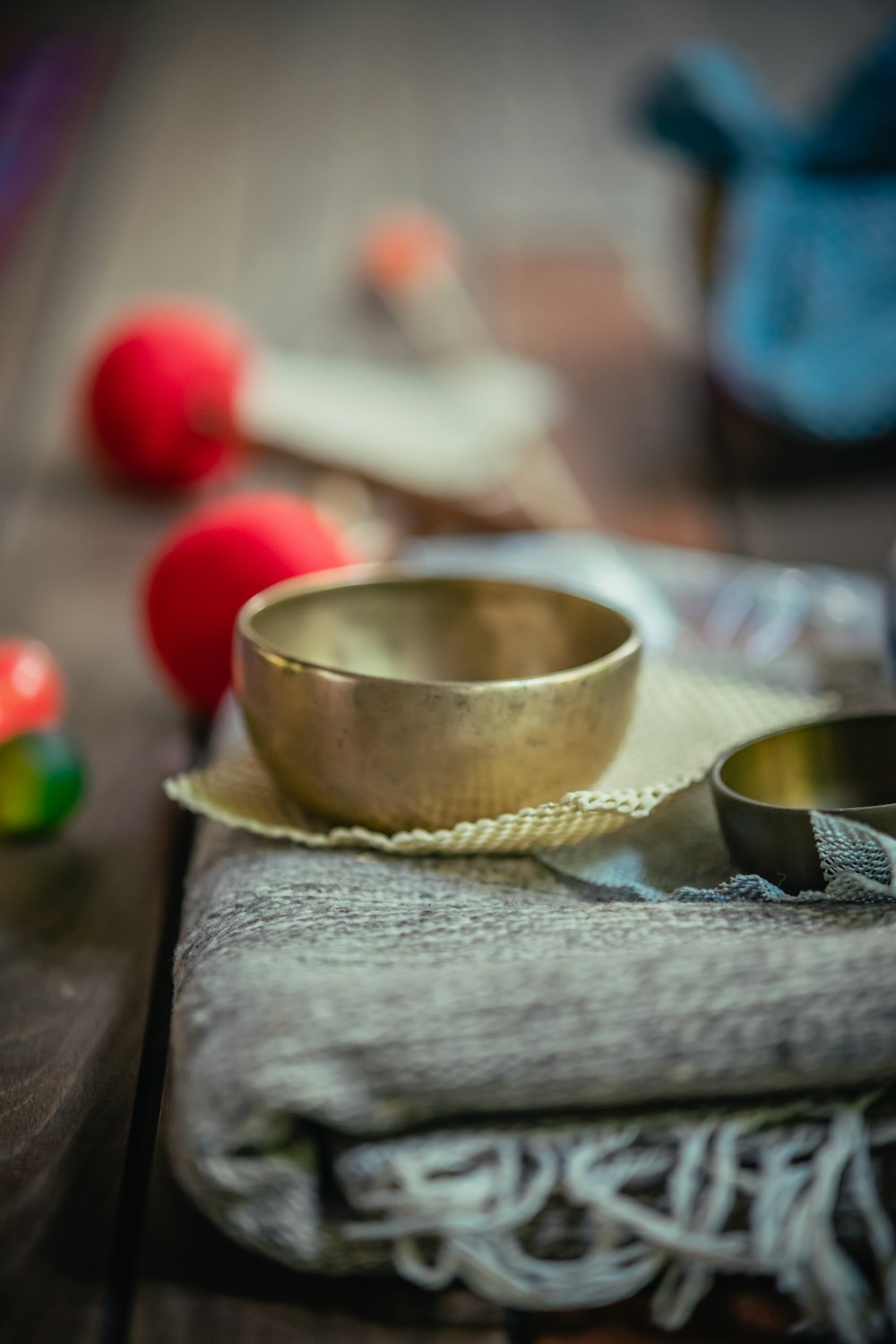 a metal bowl sitting on top of a wooden table