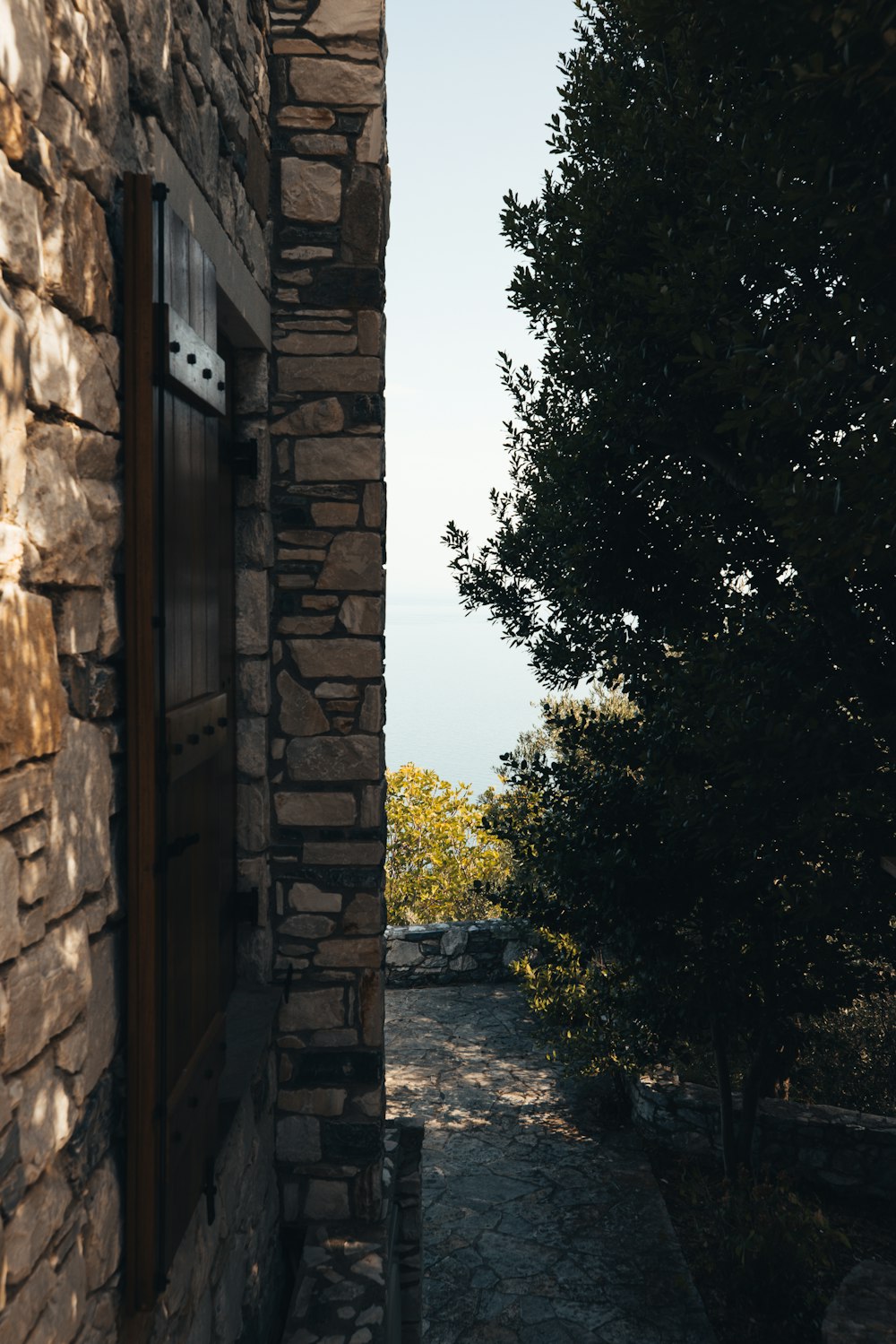 a stone building with a window on the side of it