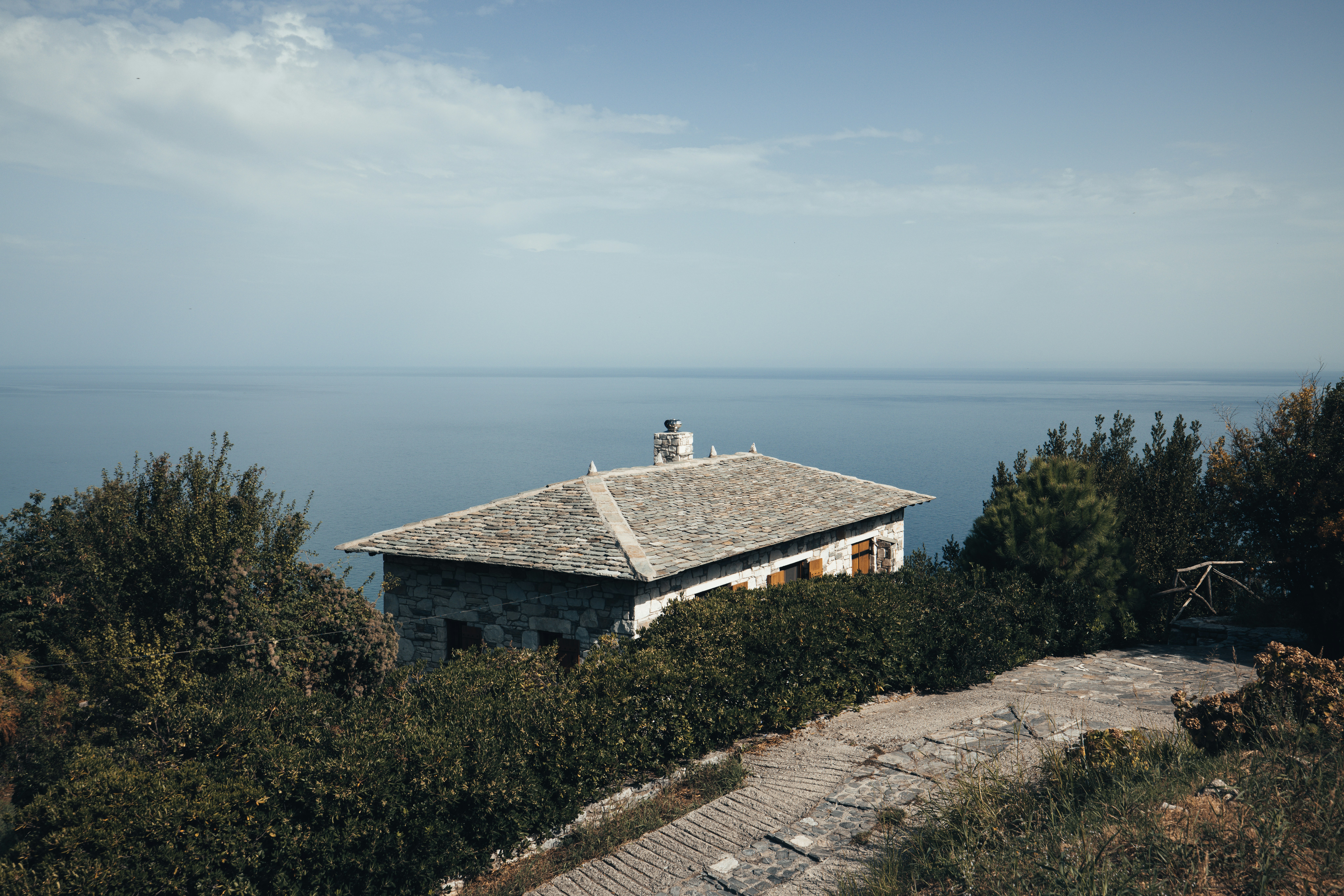 a house on a hill overlooking the ocean
