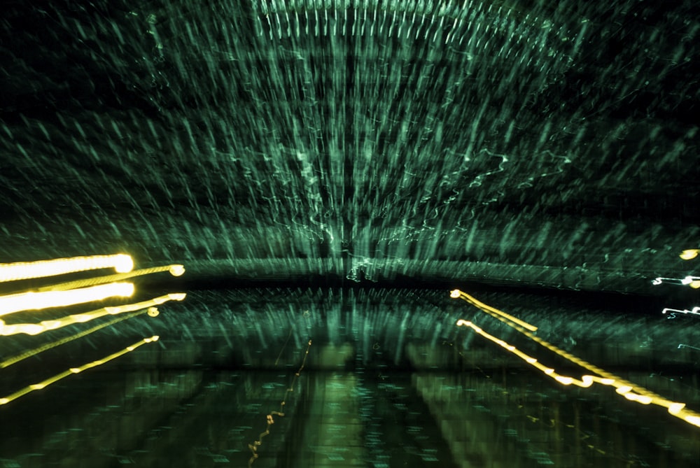 a long exposure photo of lights in a dark room