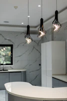 Modern LED ceiling lights illuminating a vibrant Indian kitchen.