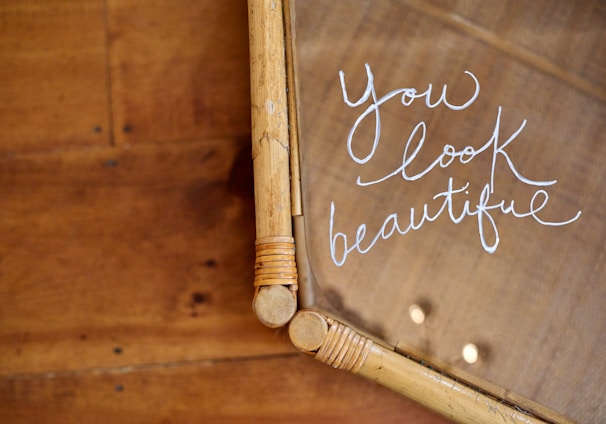 a close up of a mirror with writing on it