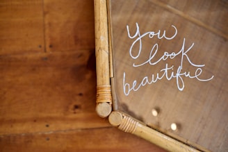 a close up of a mirror with writing on it