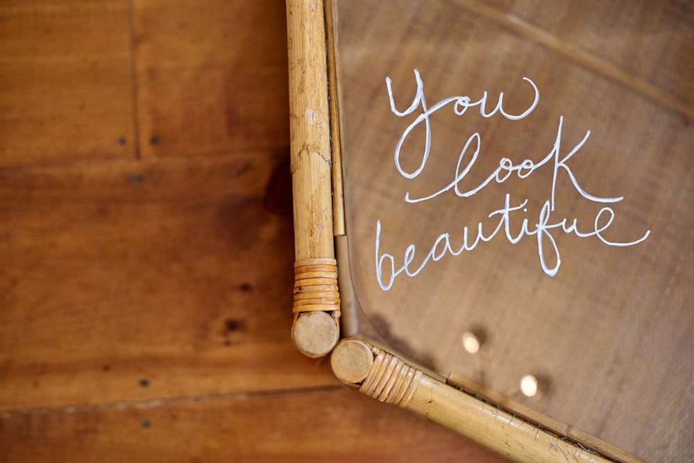 a close up of a mirror with writing on it