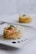 A vibrant plate of colorful, freshly prepared vegetables and grains served in a cozy setting.