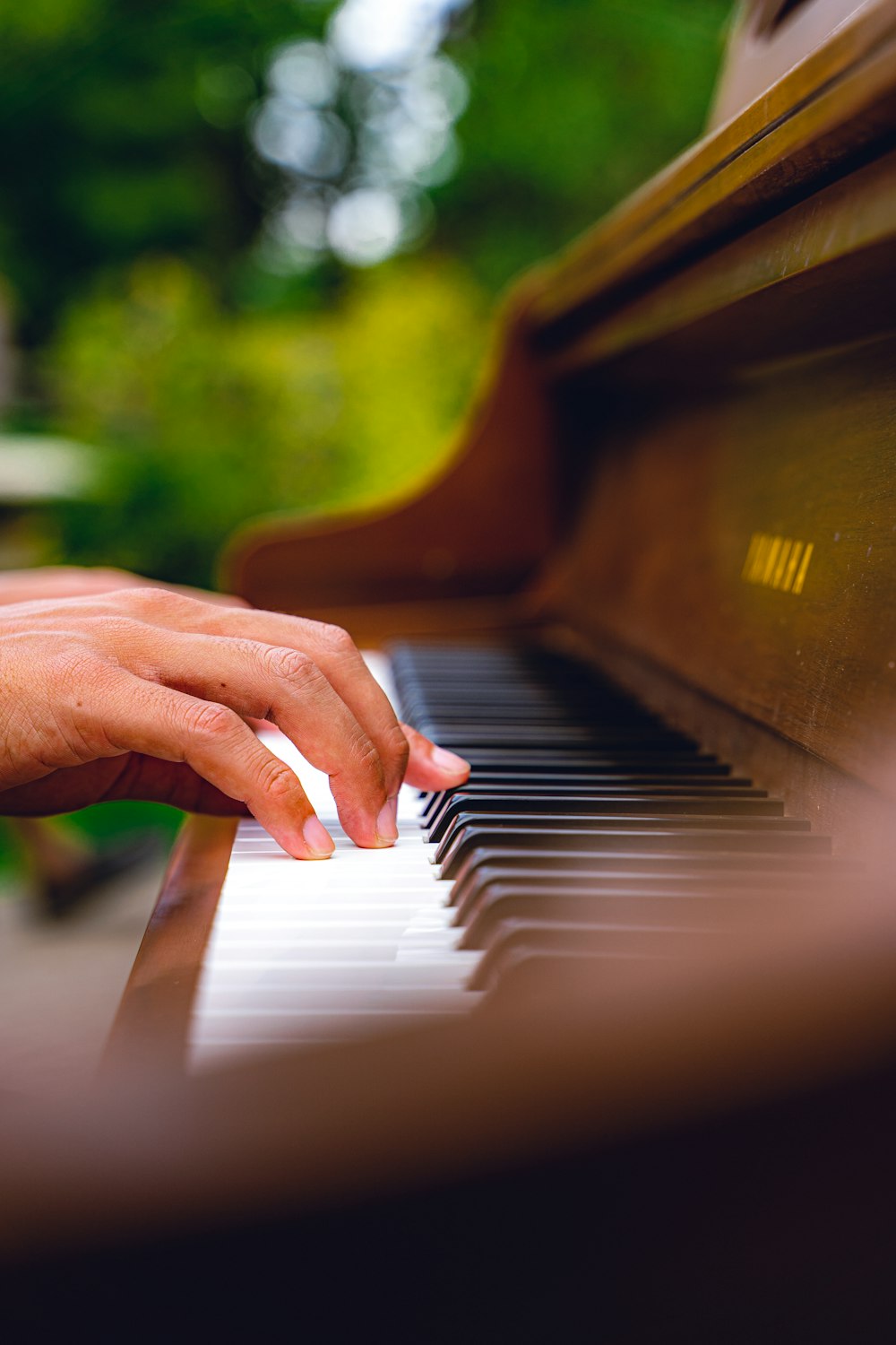 a close up of a person playing a piano