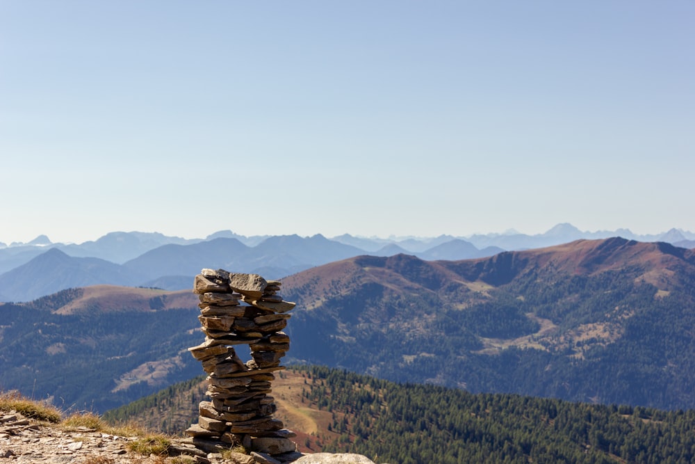 a stack of rocks on top of a mountain