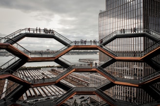 a group of people standing on top of a metal structure