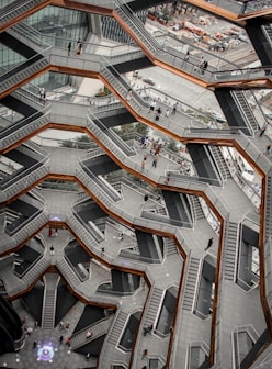 an aerial view of a building with stairs and escalators