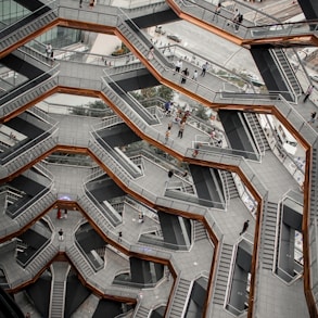 an aerial view of a building with stairs and escalators