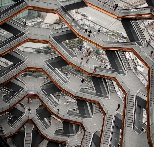an aerial view of a building with stairs and escalators
