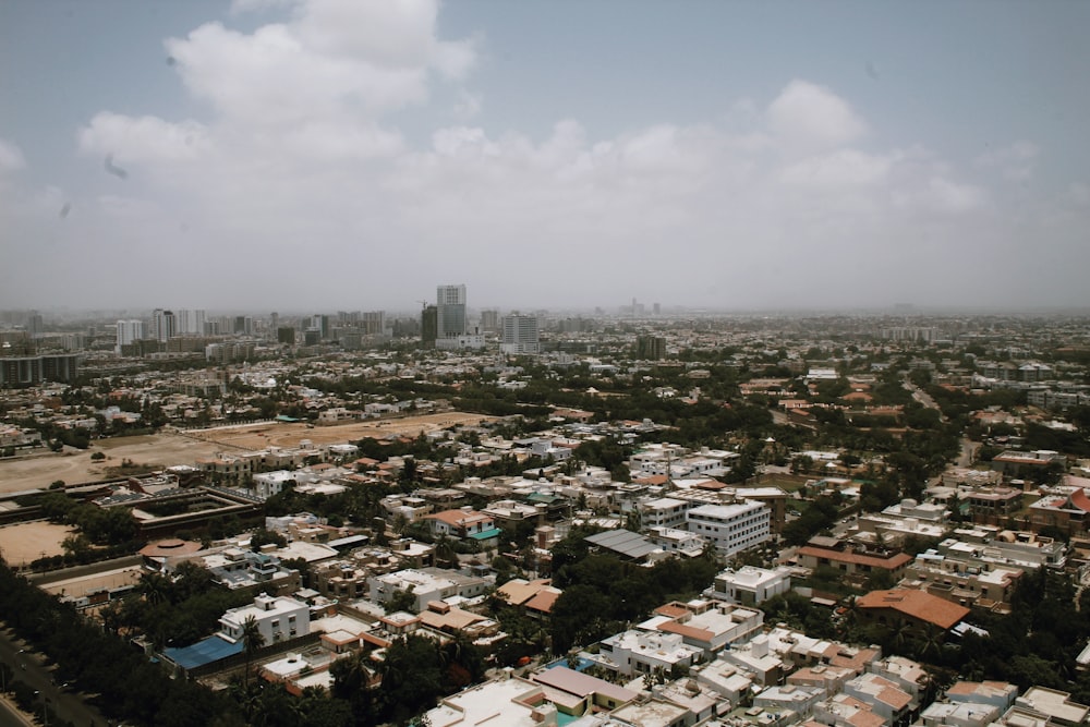 an aerial view of a city with tall buildings