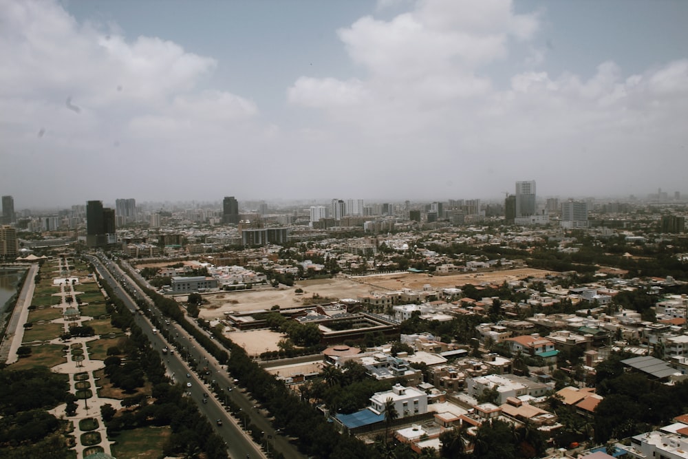 an aerial view of a city with tall buildings