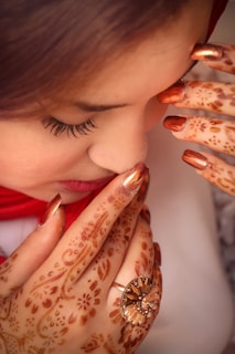 a woman with her hands on her face