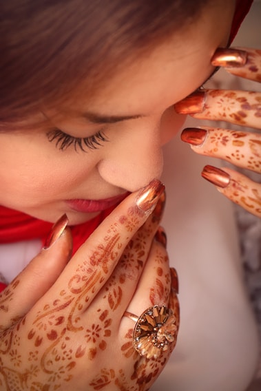 a woman with her hands on her face