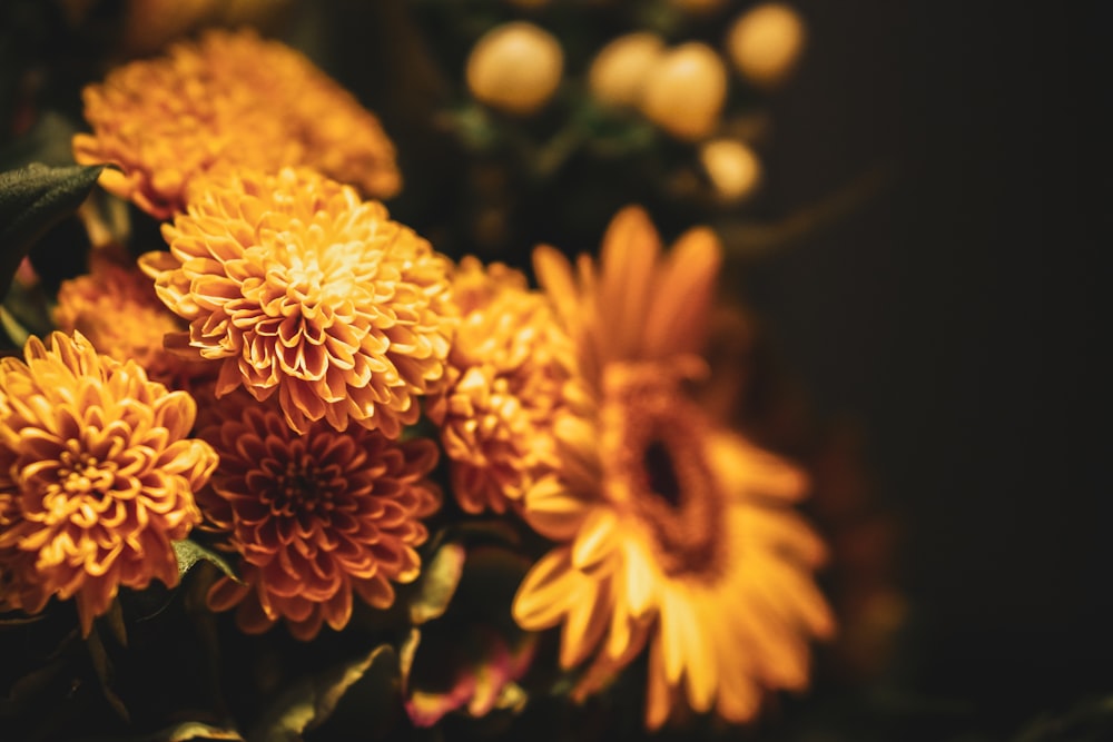 a bunch of yellow flowers sitting on top of a table