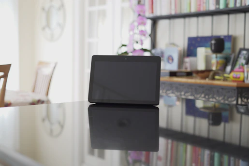 A focused referee studying training materials on a tablet in a bright, modern room.