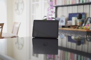 A digital tablet displaying one of our ebooks, surrounded by calming neutral-toned accessories.