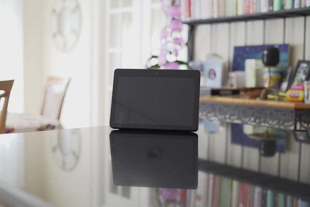 A focused referee studying training materials on a tablet in a bright, modern setting.