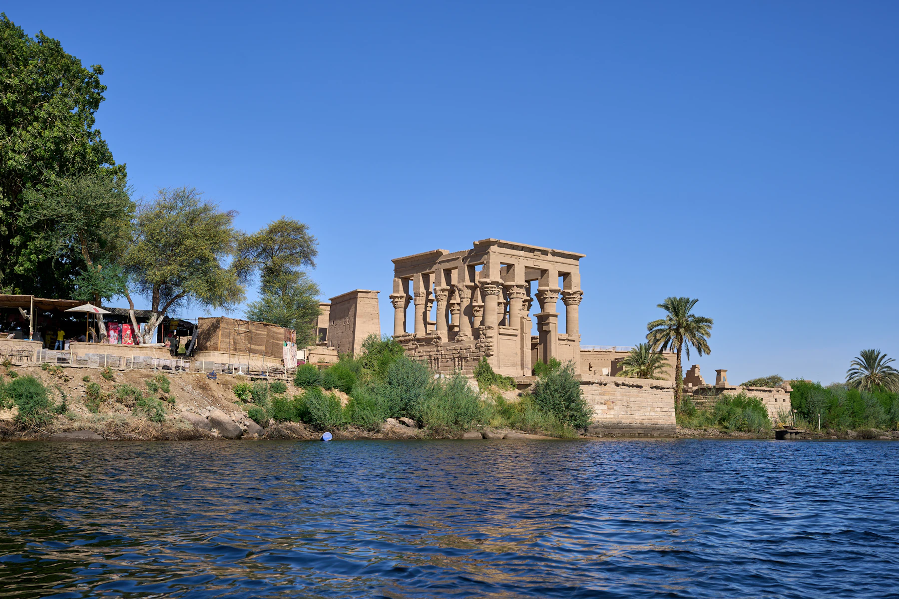 Trajan's Kiosk stands at the water's edge on Philae's island site.