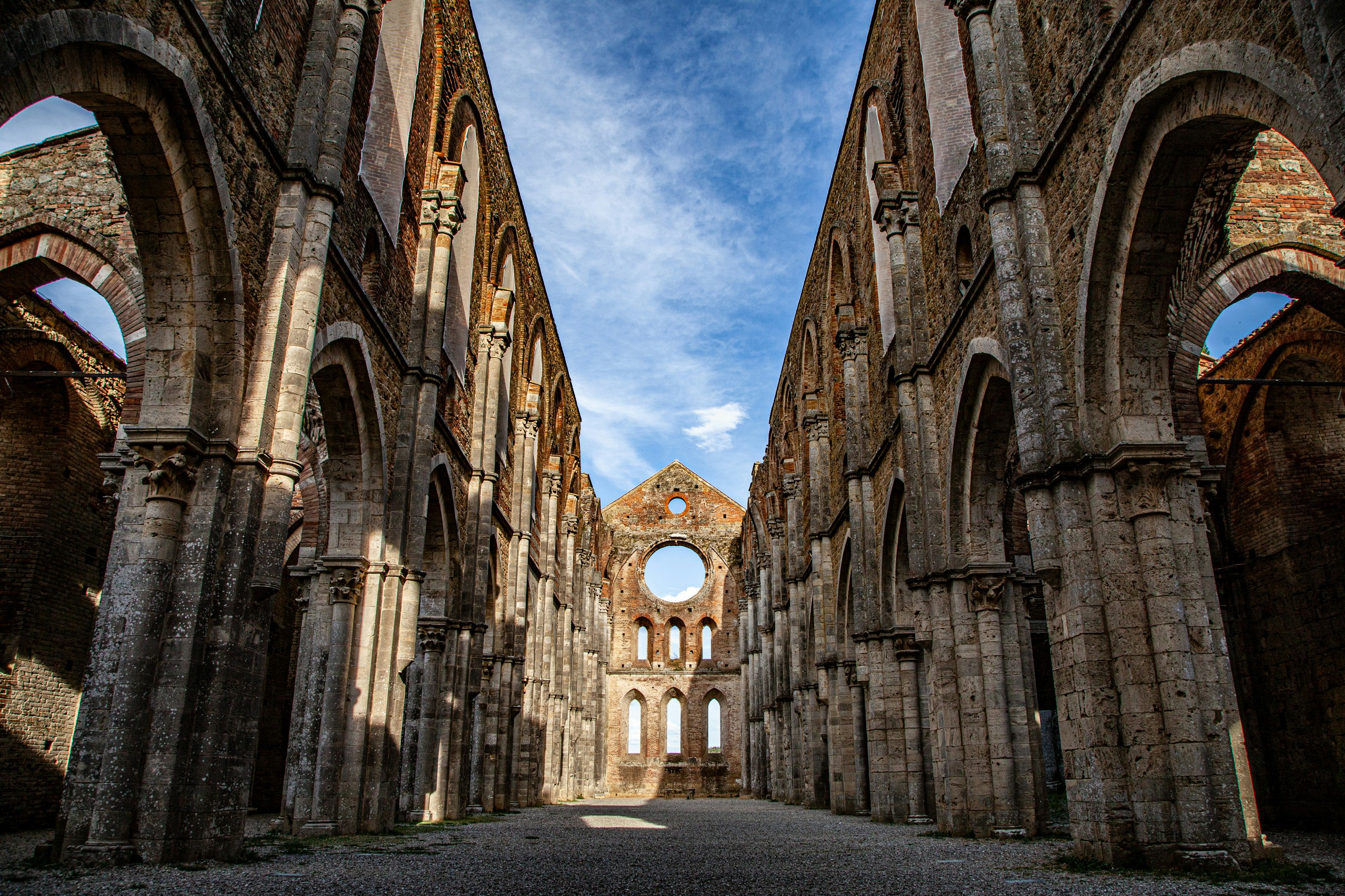a large stone building with arches and windows, 