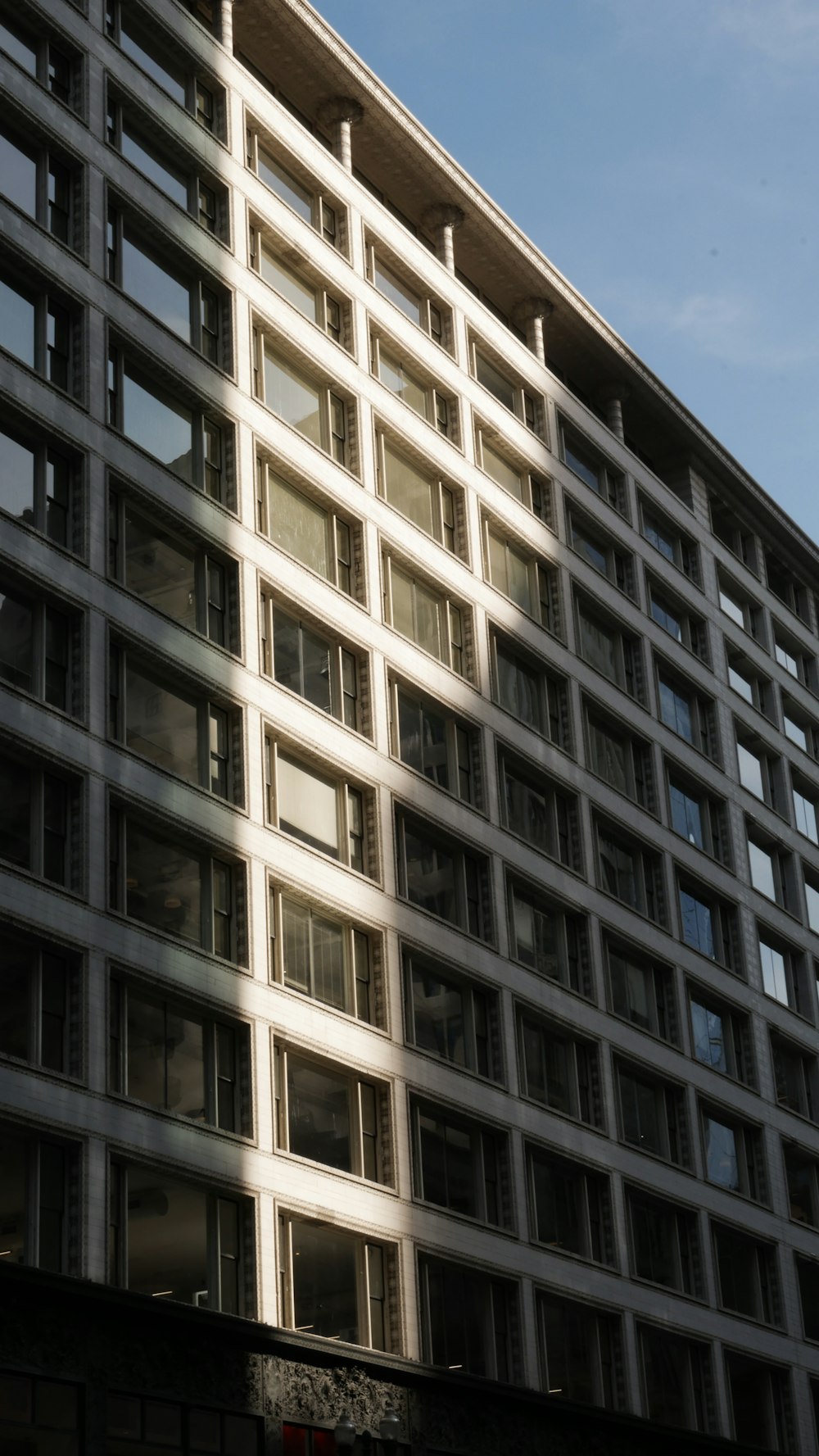 a tall building with lots of windows on top of it