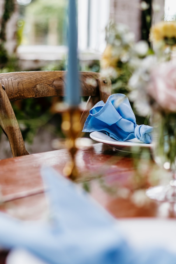 a wooden table topped with a plate of food