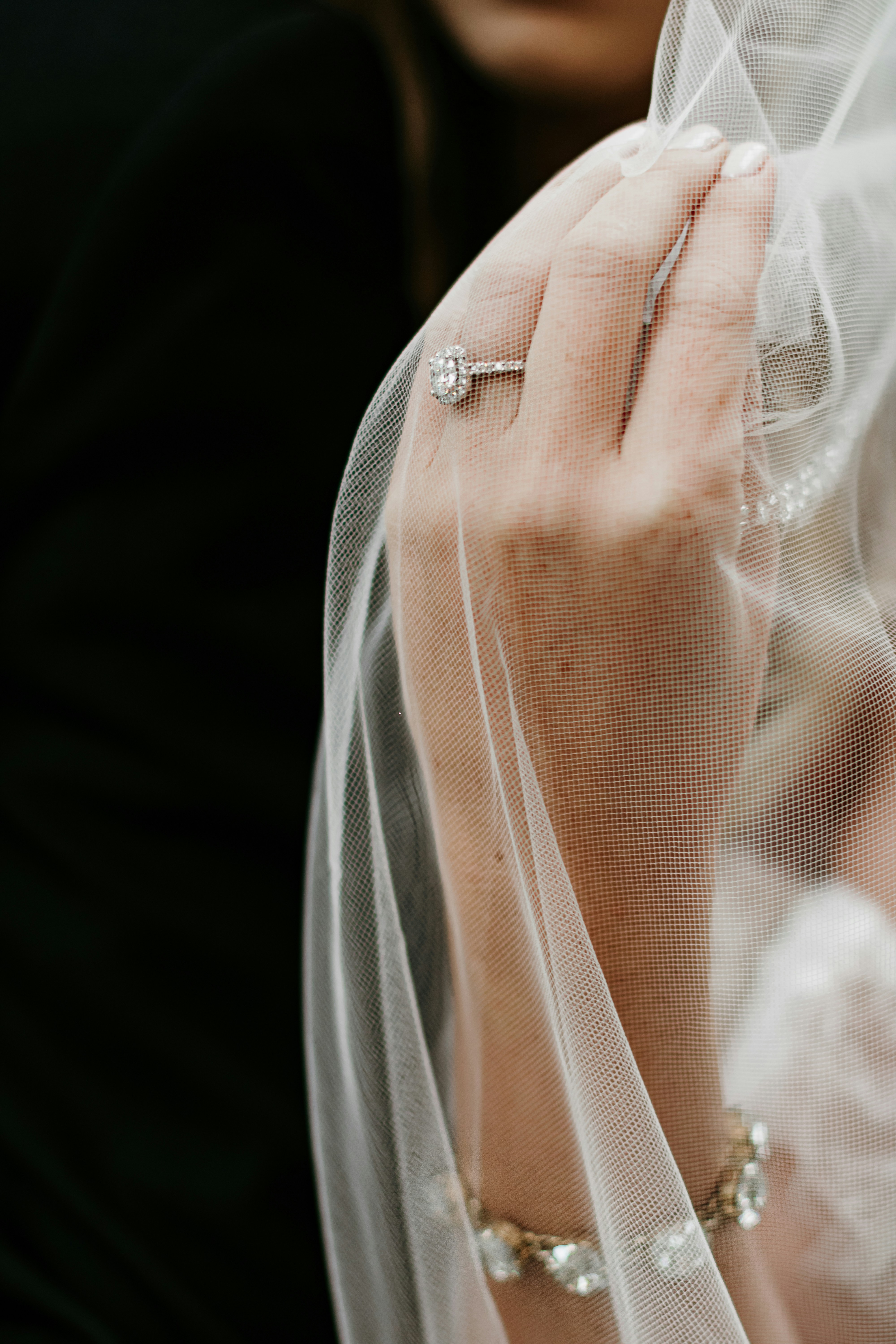 a close up of a person wearing a wedding ring
