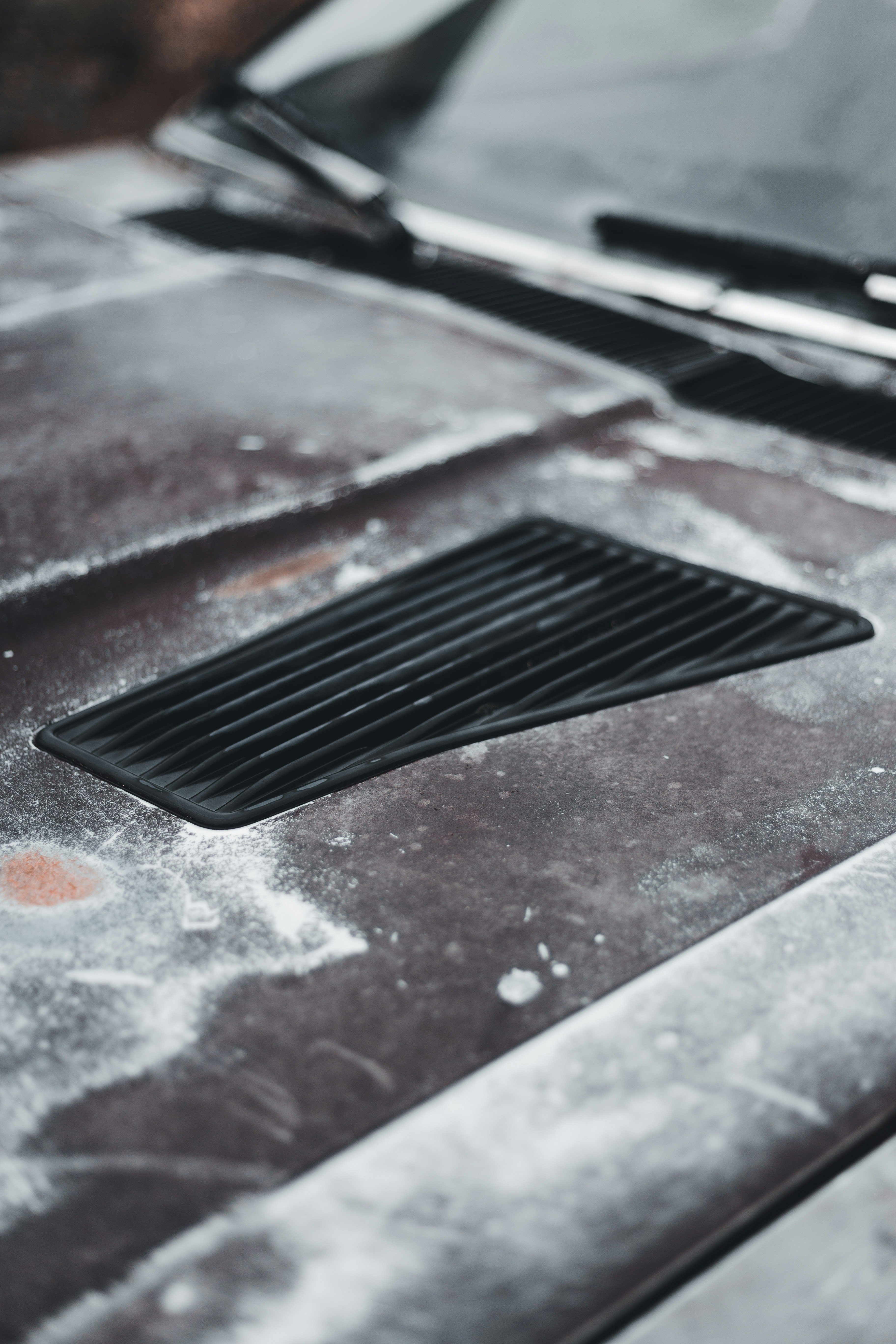 A close up of the hood of a car photo Free Image on Unsplash