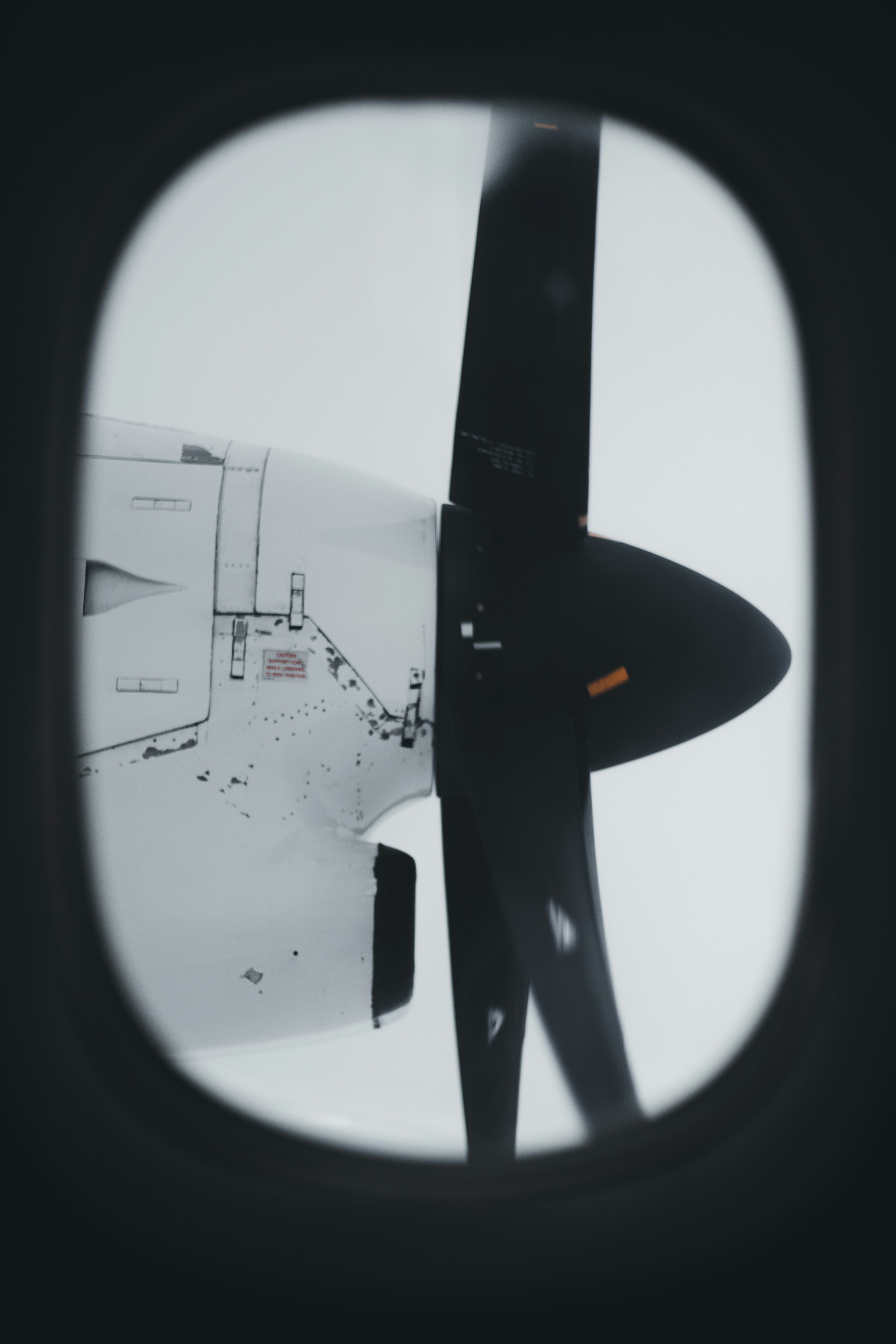 a view of the wing of an airplane through a window