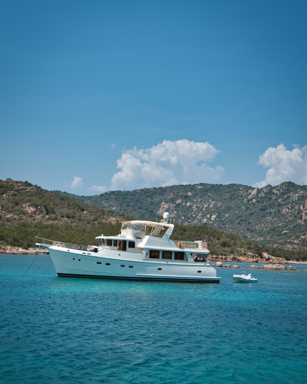 a large white boat floating on top of a body of water