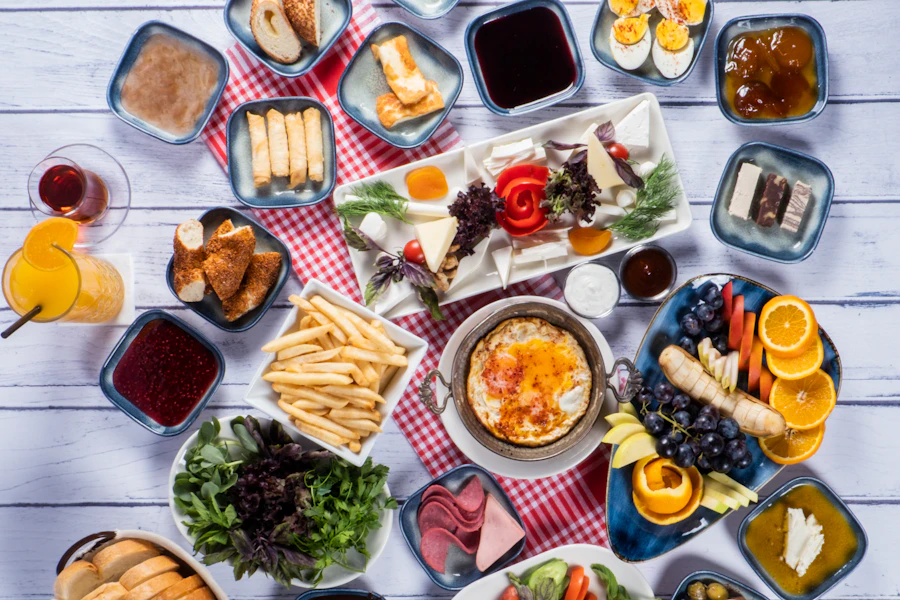 Traditional Turkish breakfast spread with bread, cheese, olives, tomatoes and tea