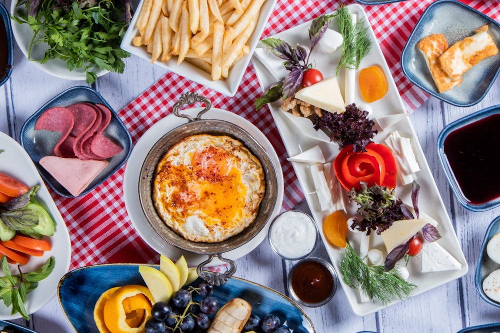 a table topped with lots of different types of food