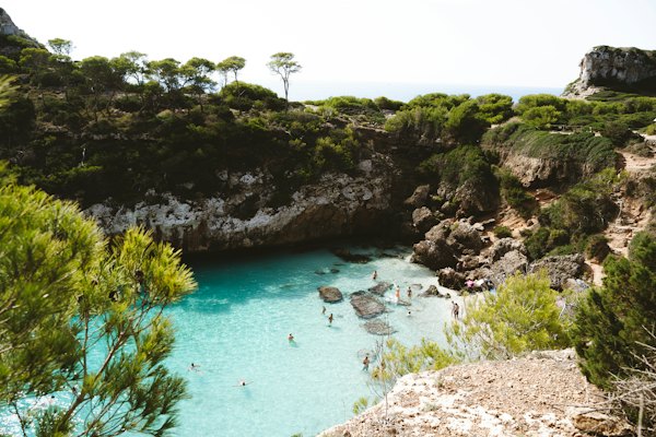 A group of people swimming in a blue lagoon — Mallorca, Spain