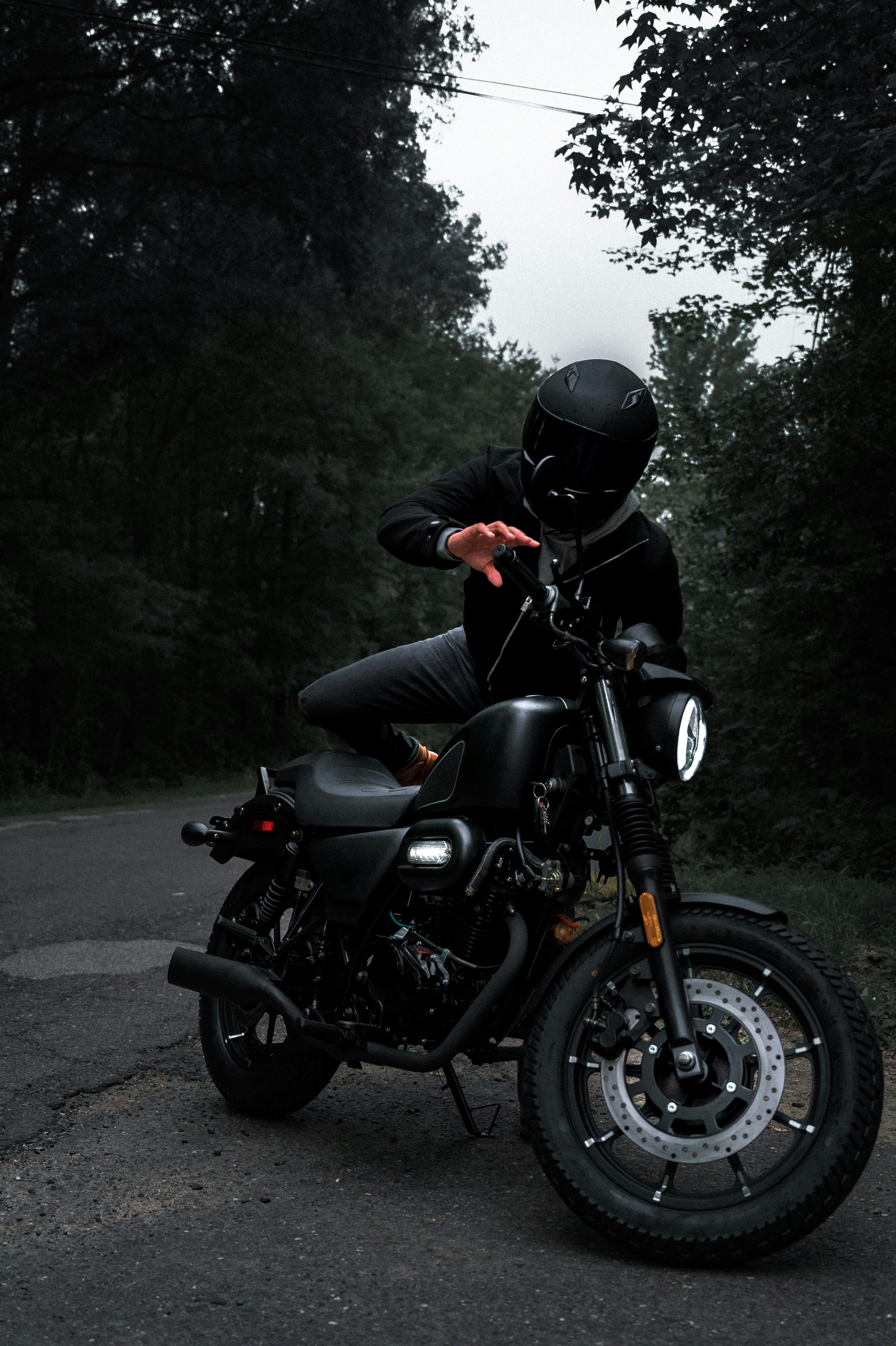 a man in a helmet is sitting on a motorcycle