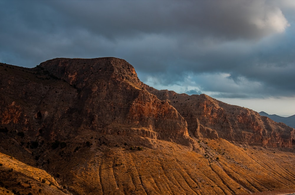 a mountain range with a body of water in the foreground