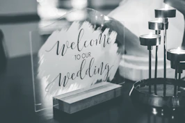 a black and white photo of a welcome sign