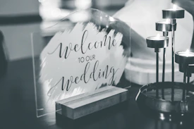a black and white photo of a welcome sign