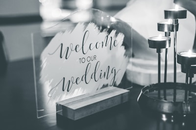 a black and white photo of a welcome sign
