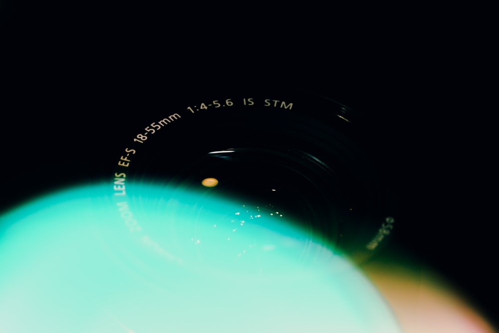 a close up of a camera lens with a blurry background