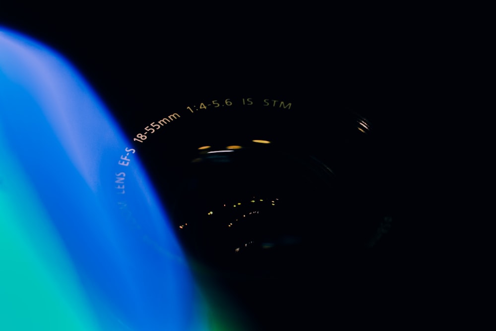 a blurry image of a camera in the dark