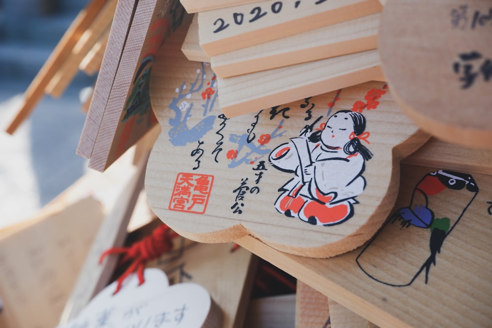 a bunch of wooden signs with asian writing on them