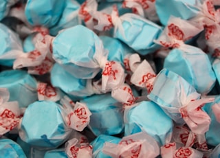 a pile of blue and white candies on top of each other