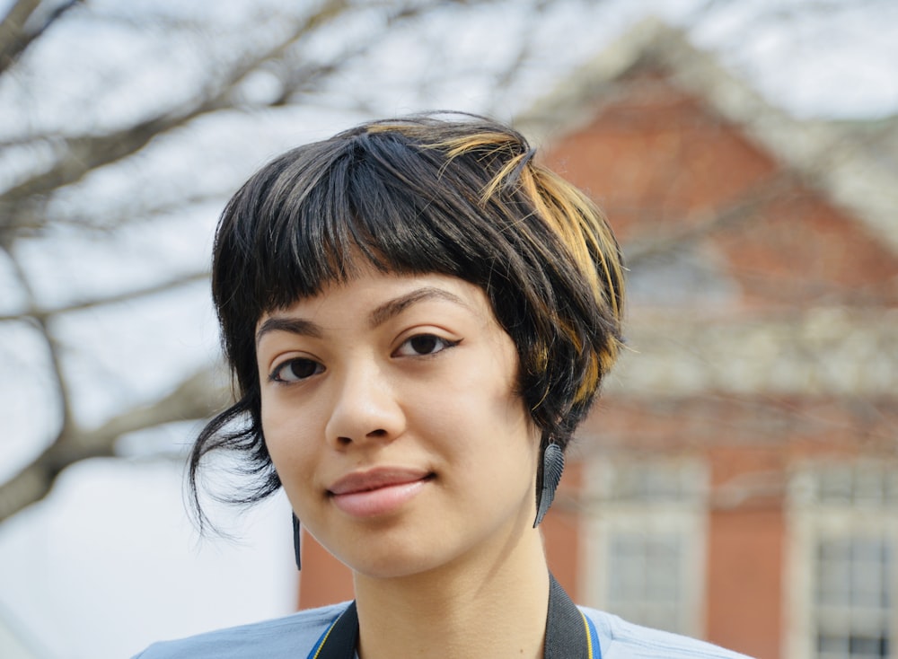 a close up of a person wearing a necklace